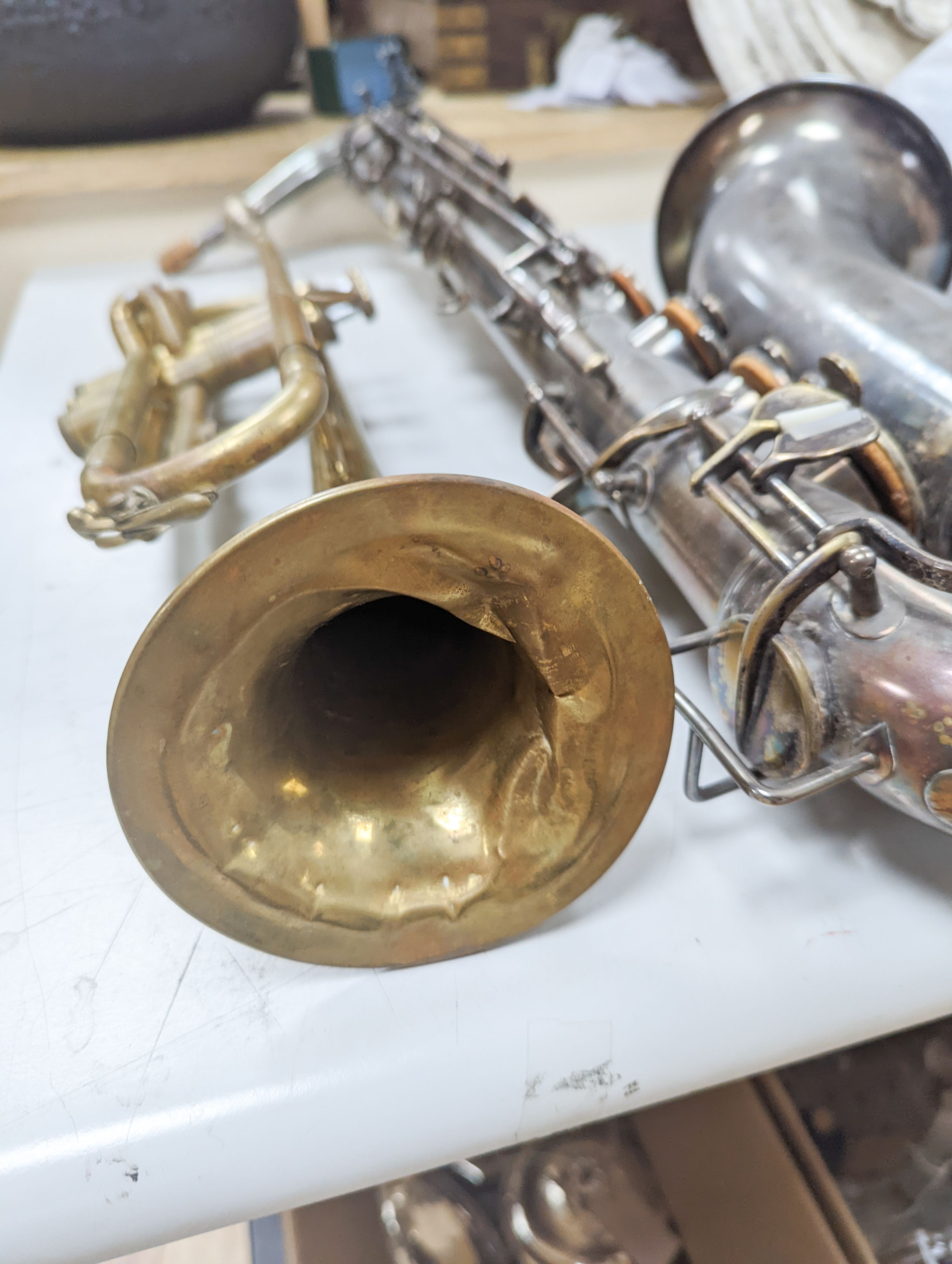 An Excelsior sonorous class A Hawkes & Son saxophone, and a Grafton Dallas, London trumpet with accessories
